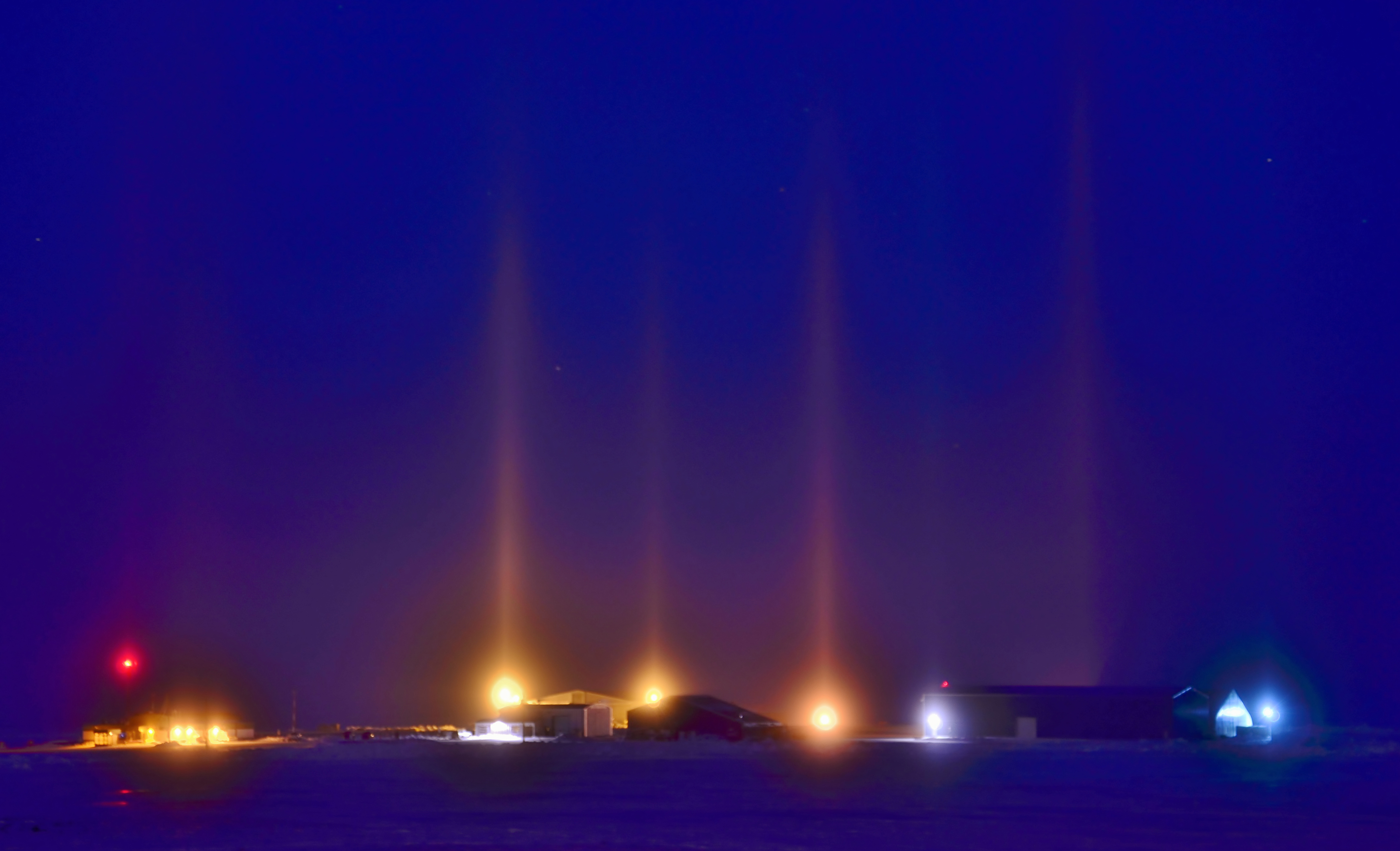 &lt;strong&gt;Figure 1.&lt;/strong&gt; Light pillars—including these examples over Cambridge Bay in Nunavut, Canada—form when light shines through atmospheric ice crystals. The crystals align as they fall through turbulent air, which allows for coherent light scattering. Figure courtesy of &lt;a href=&quot;https://www.flickr.com/photos/37967119@N08/17239657746/&quot; rel=&quot;noopener noreferrer&quot; target=&quot;_blank&quot;&gt;Eric Van Lochem and Flickr&lt;/a&gt; under the &lt;a href=&quot;https://creativecommons.org/licenses/by-sa/2.0/&quot; rel=&quot;noopener noreferrer&quot; target=&quot;_blank&quot;&gt;Attribution-ShareAlike (CC BY-SA 2.0) Generic license&lt;/a&gt;.