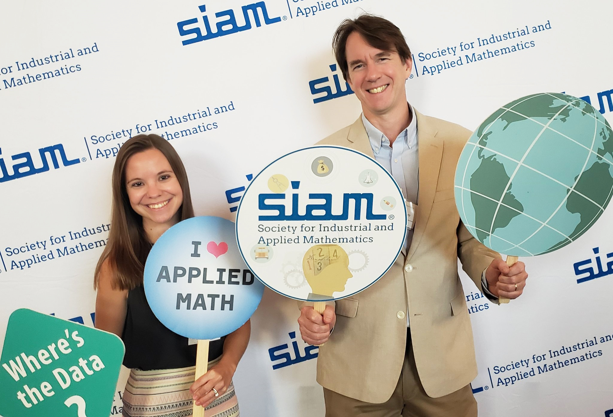 Lina Sorg (left), the managing editor of &lt;em&gt;SIAM News&lt;/em&gt;, poses with Richard Moore, SIAM’s Director of Programs and Services, at the 2022 SIAM Conference on Mathematics of Data Science, which took place this September in San Diego, Ca. SIAM photo.