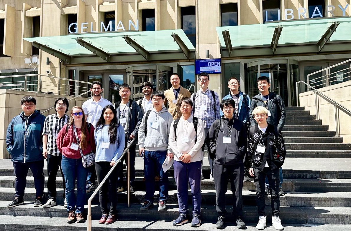 Attendees of the George Washington University (GW) SIAM Student Chapter’s 5th Annual Conference on Applied Mathematics: Emerging Trends in Data Science and Deep Learning pose together on the GW campus in April 2024. Photo courtesy of Conglong Xu.