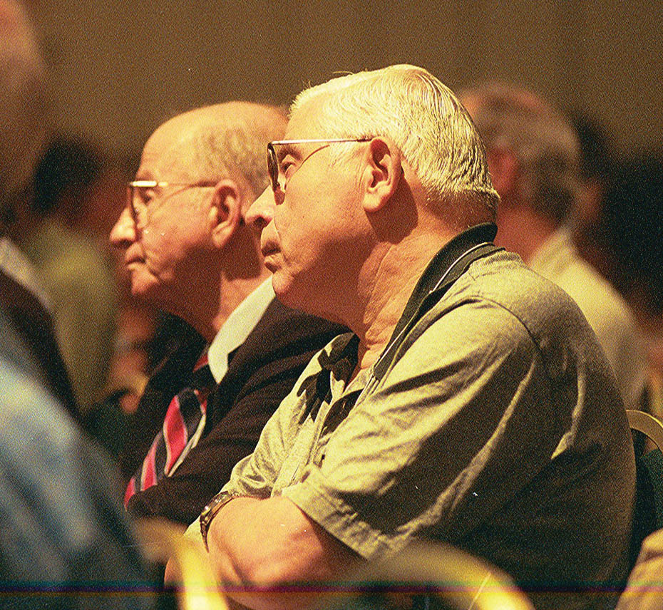 Ed Block and SIAM director of finance Bob Bellace, who had been colleagues at Auerbach, listened to a talk at the SIAM 50th Anniversary and 2002 Annual Meeting in Philadelphia. Photo by Lois Sellers.